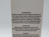 a close up of a bottle of liquid sitting on a table