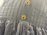 a close up of a dress with a star on it