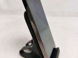 a cell phone that is sitting on a stand