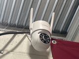 an image of a security camera attached to a wall