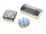 several different types of tins are sitting on a white surface