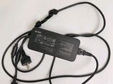 an image of a laptop charger with a cord attached