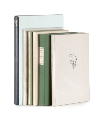 three books and a pencil are stacked on top of each other