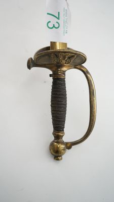 a gold sword with a black handle on a white background