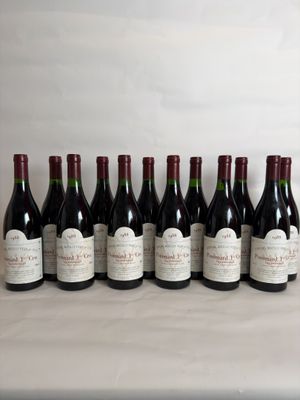 six bottles of wine are lined up on a table