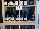 many bottles of wine on the shelves in the store