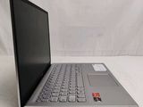 an open laptop computer sitting on top of a white table