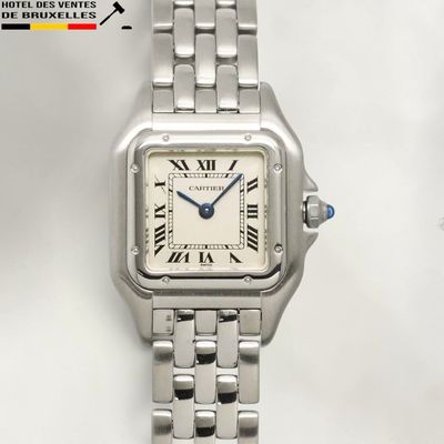 a close up of a wrist watch with roman numerals on it