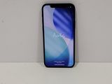 a close up of a phone on a table with a white background
