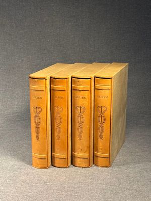 three books sitting on top of each other on a table