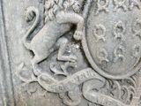 a statue of a lion with a shield on it ' s head