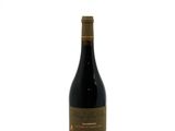 a bottle of wine that is sitting on a table
