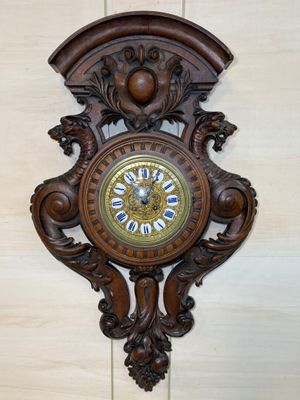 a clock hanging on the wall in the corner of the room