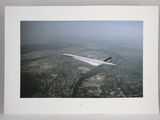 a picture of a picture of a plane flying in the sky