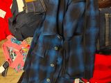 a pile of clothing that is sitting on the floor