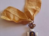 medal of the order of the crown of france with a gold ribbon on a white background