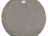 a round metal plate with holes on it