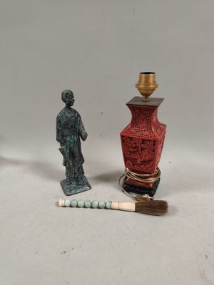 two miniature figurines that are sitting next to each other
