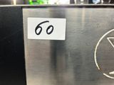 a close up of a stainless steel sign with a number 60 on it