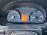 a close up of a car dashboard with a speedometer and a steering wheel
