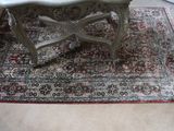 a small table on a rug in a room
