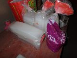 many bags of food on a table in the room
