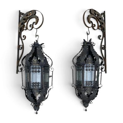 pair of antique iron wall sconces with glass panels