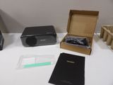 a black printer sitting on a white table next to other items