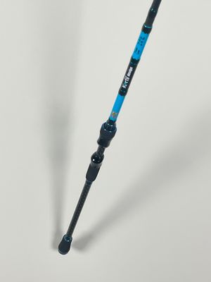 a close up of a blue and black tripod on a white surface