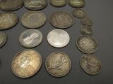 a lot of coins that are on the table