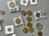 a lot of coins that are sitting on a table