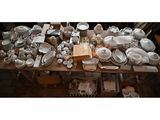 a table with a lot of dishes and bowls on it