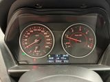 a close up of a car dashboard with a speedometer