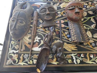 a table with a lot of african items on it