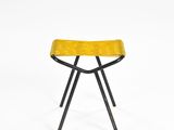 a yellow stool with black legs on a white background