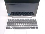 a laptop that is sitting on a white table
