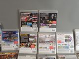 a lot of nintendo wii games on the table