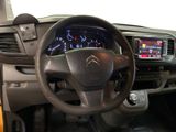 steering wheel and dashboard of a car with a clock on the dashboard