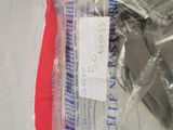 a toothbrush and a toothpaste in a plastic bag