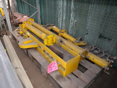 a yellow machine that is sitting on a pallet