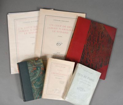 several books are stacked on top of each other on a table
