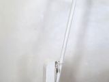 a close up of a white stand with a light on it