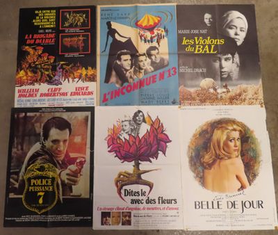 various movie posters on a table in a room