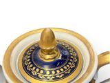 an image of a blue and gold tea pot