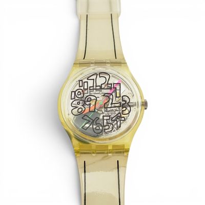 une image d'un gros plan d'une montre-bracelet sur une surface blanche