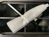 a white towel hanging from the handle of a dishwasher