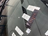 a sticker on the windshield of a car with a ruler attached to it