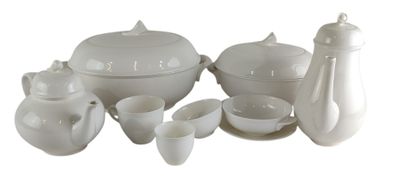 a picture of a white table setting with a tea pot and cups
