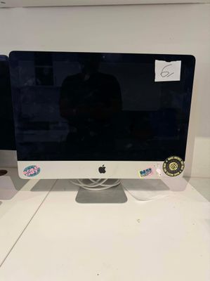a computer monitor sitting on top of a white desk