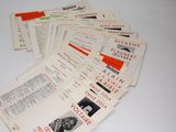 several pamphlets are stacked on top of each other on a table
